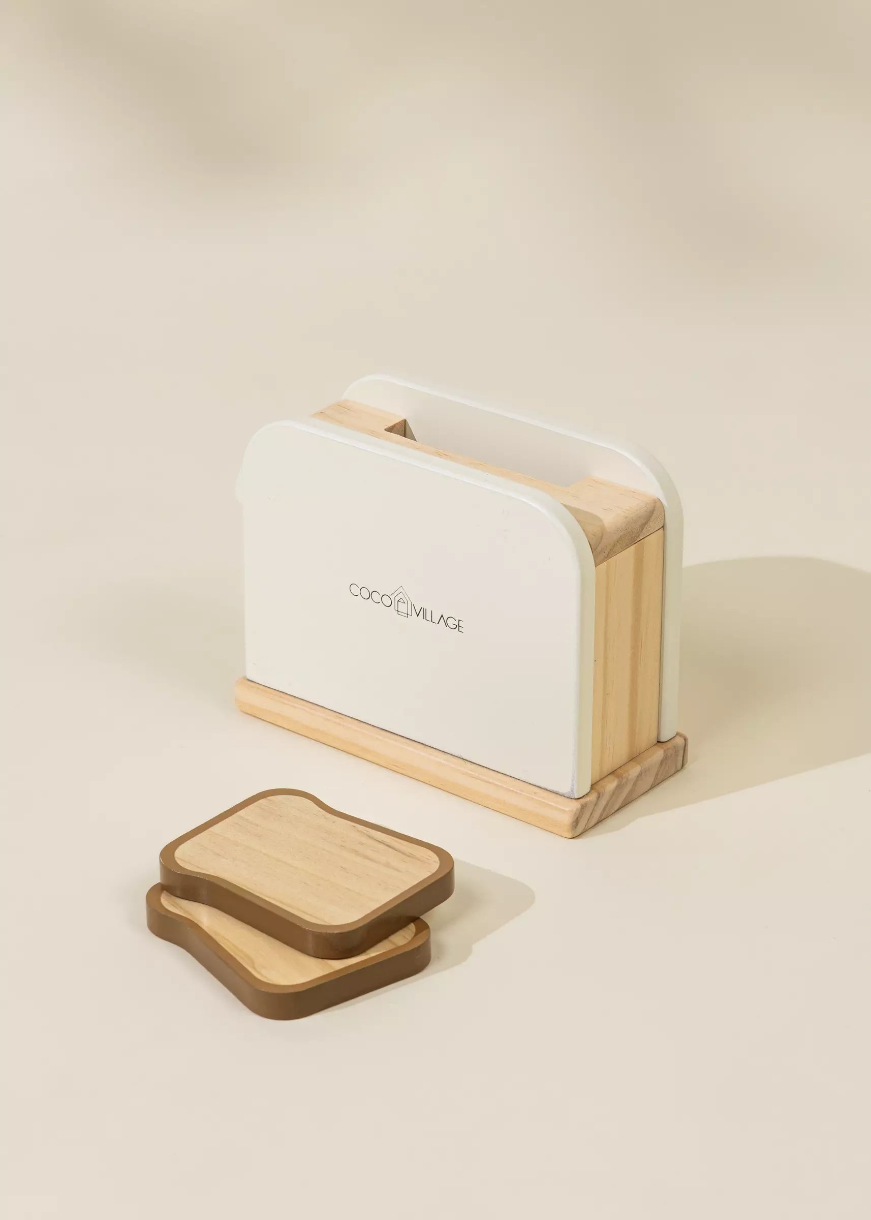 Wooden toaster with white interior on a beige background