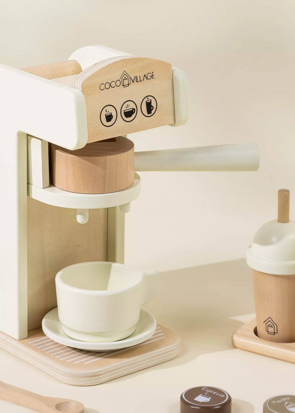 Wooden coffee maker with a white cup on a beige background