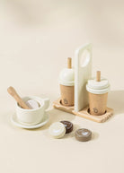 Set of wooden and ceramic kitchen items on a beige background