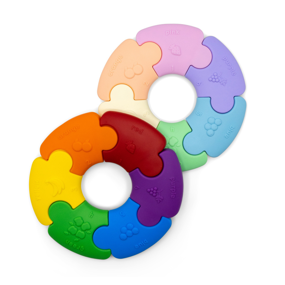 Colorful puzzle ring toy on a white background