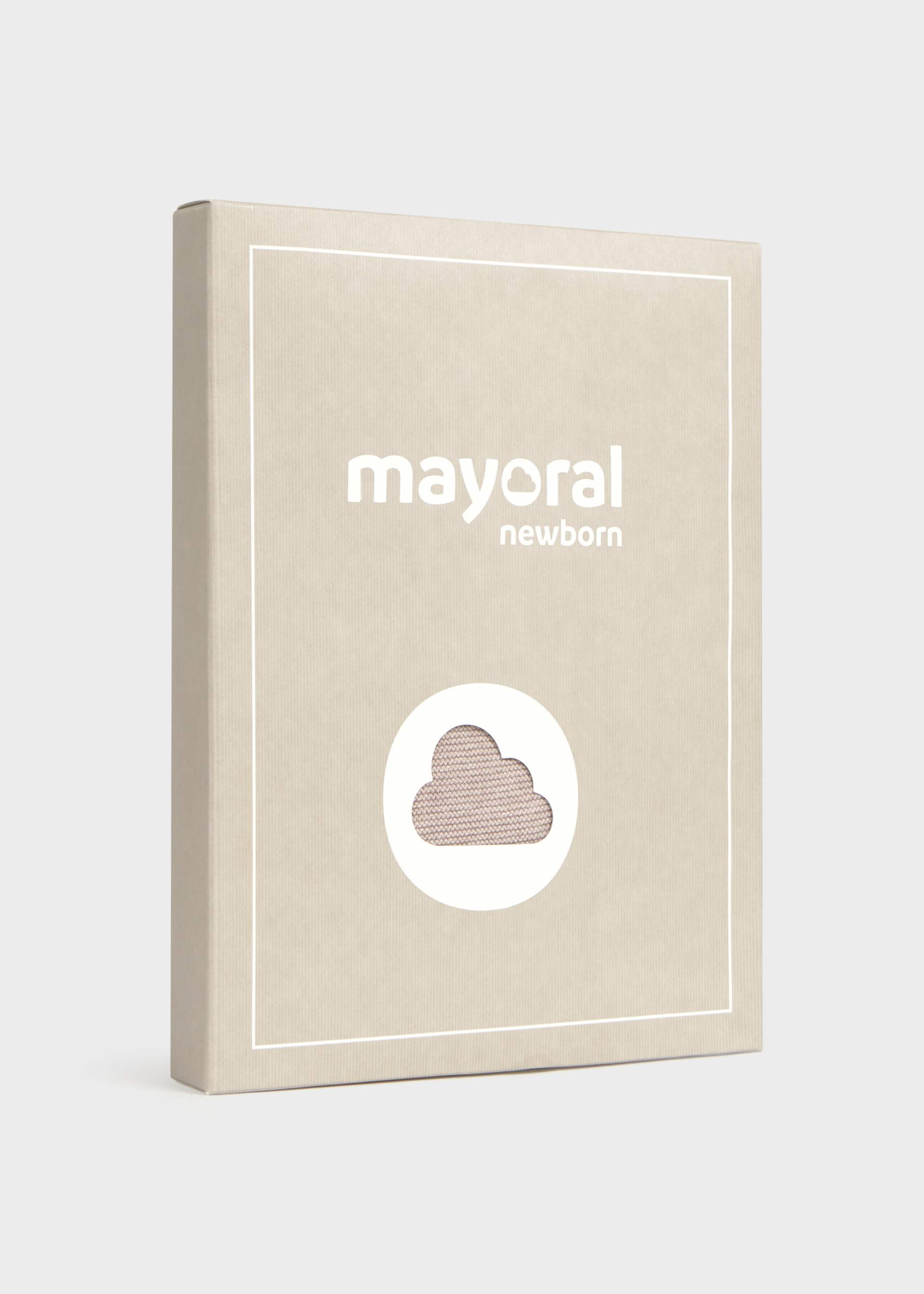 A beige rectangular product box with white border lines and the text 'mayoral newborn' on the front, plus a circular cutout showing a textured cloud-like pattern. The box is photographed on a clean light gray background.