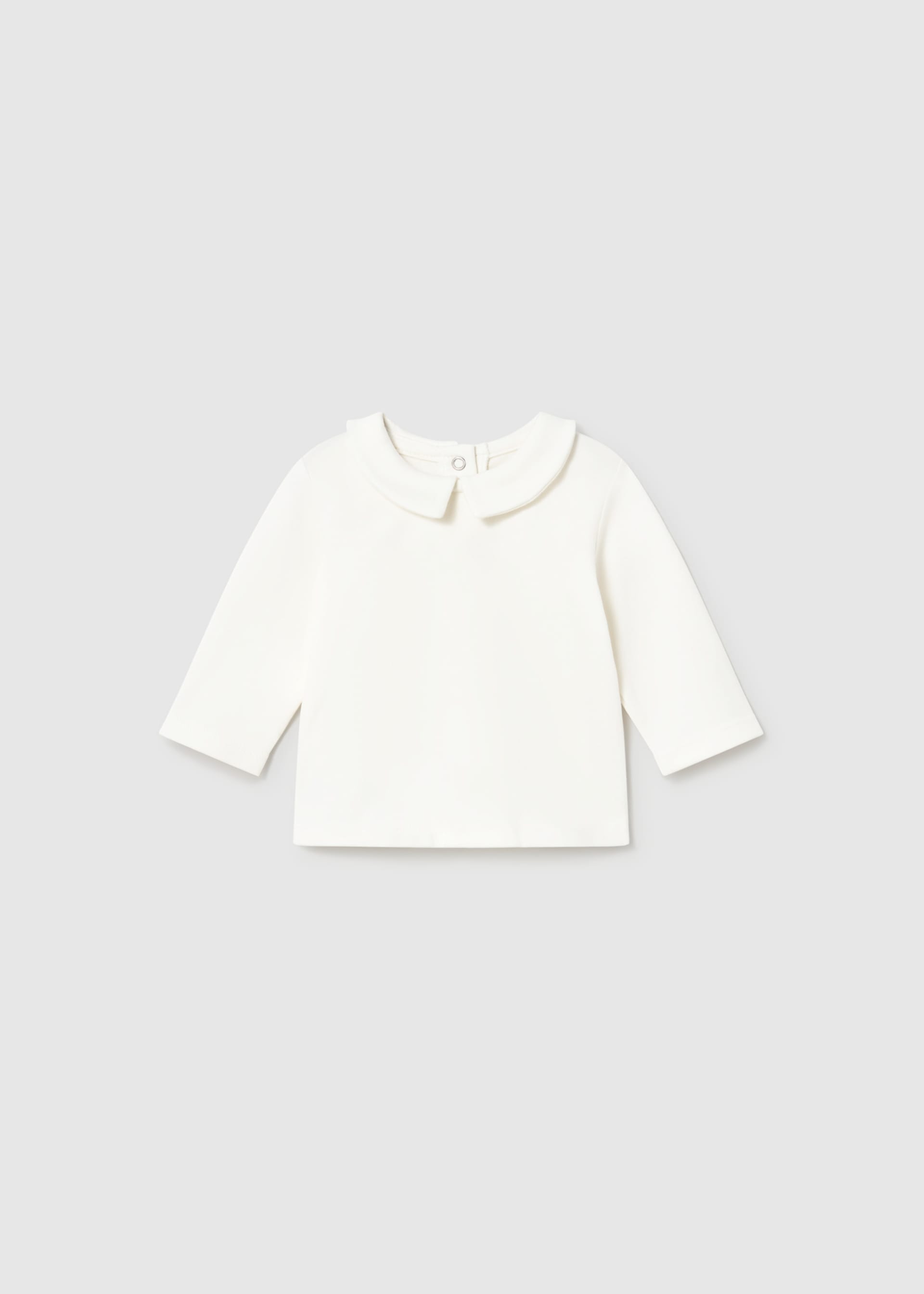 White long-sleeve shirt on a light gray background