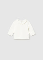 White long-sleeve shirt on a light gray background