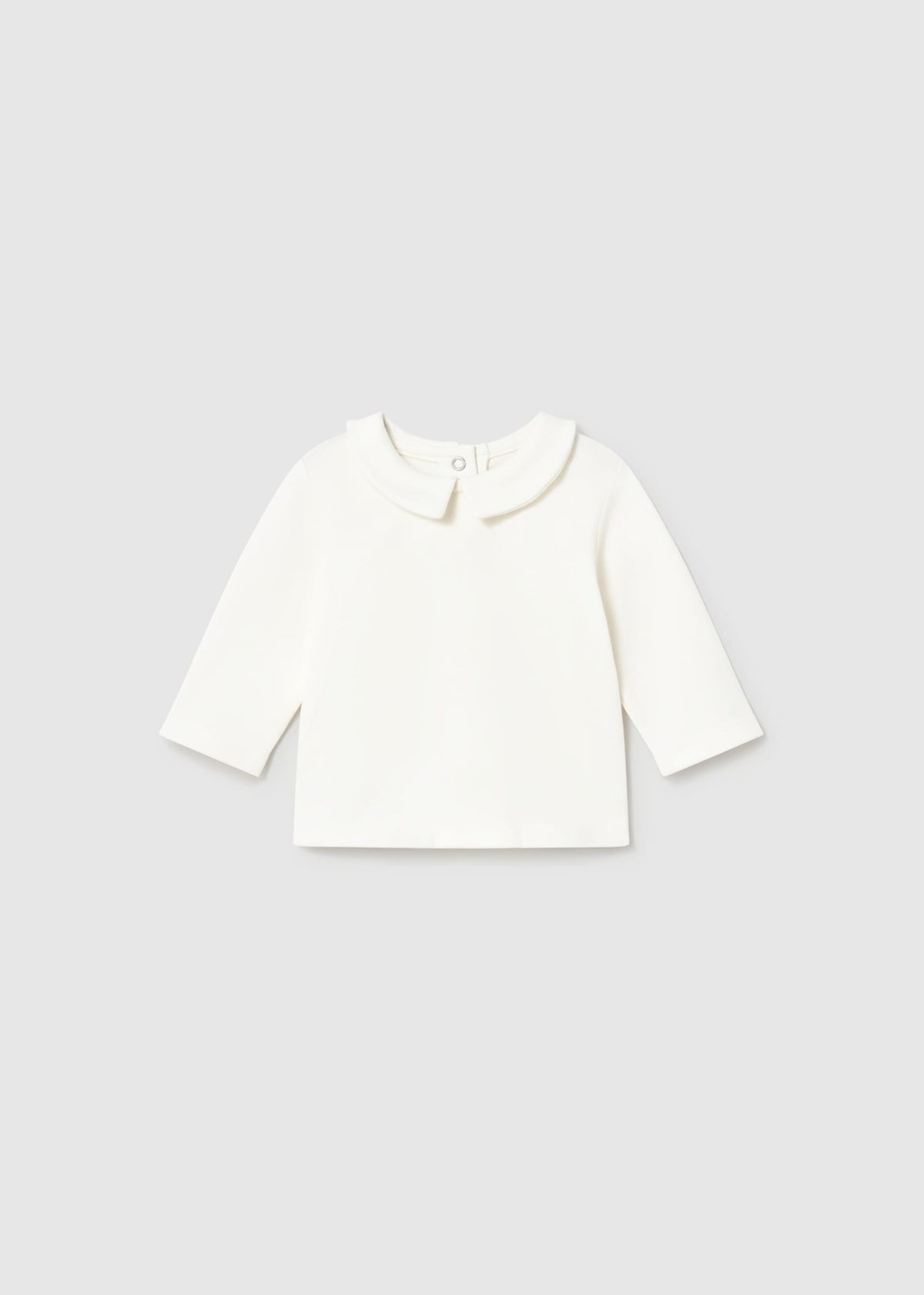 White long-sleeve shirt on a light gray background