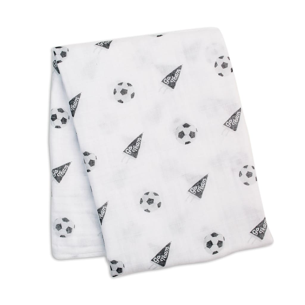 Folded white blanket with black and gray geometric pattern on a white background