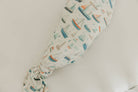 Baby swaddle with boat pattern on a light background