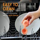 Hand holding a small orange object above a dishwasher with text 'Easy to Clean' and 'Top rash dishwasher safe for quick cleanup'.