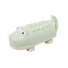 Light green alligator-shaped toy on a white background