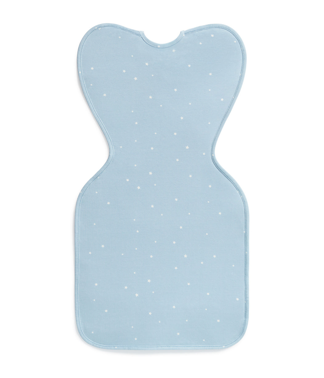 Light blue bib with white polka dots on a white background
