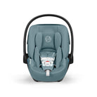 Blue baby car seat with black frame on a white background