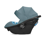 Blue and black baby car seat on a white background