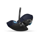Black baby car seat with blue accents on a white background