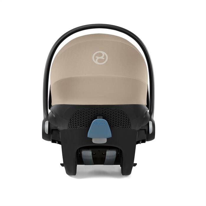 Baby car seat with beige canopy and black frame on a white background