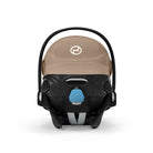 Baby car seat with beige cover and black frame on a white background
