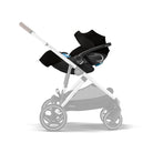Baby stroller with black car seat attachment on a white background