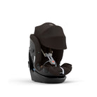 A black baby car seat with a matching black canopy and harness, shown from a three-quarters angle on a clean white background.