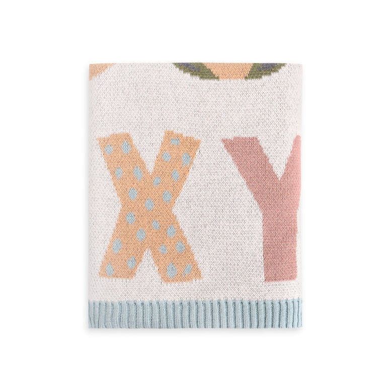 Knitted blanket with 'X' and 'Y' letters on a white background