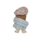 Stuffed doll with a pink hat and blue checkered coat on a white background