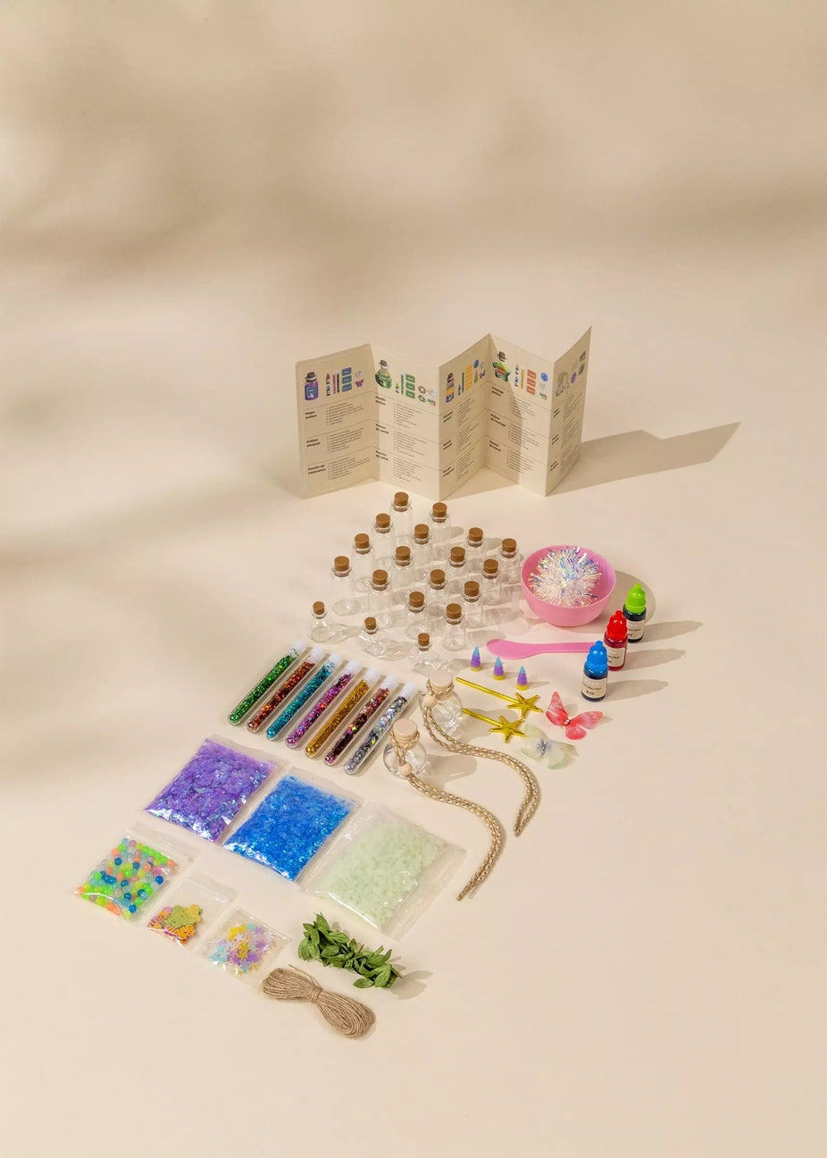 Assorted craft supplies including beads, ribbons, and a map on a beige background