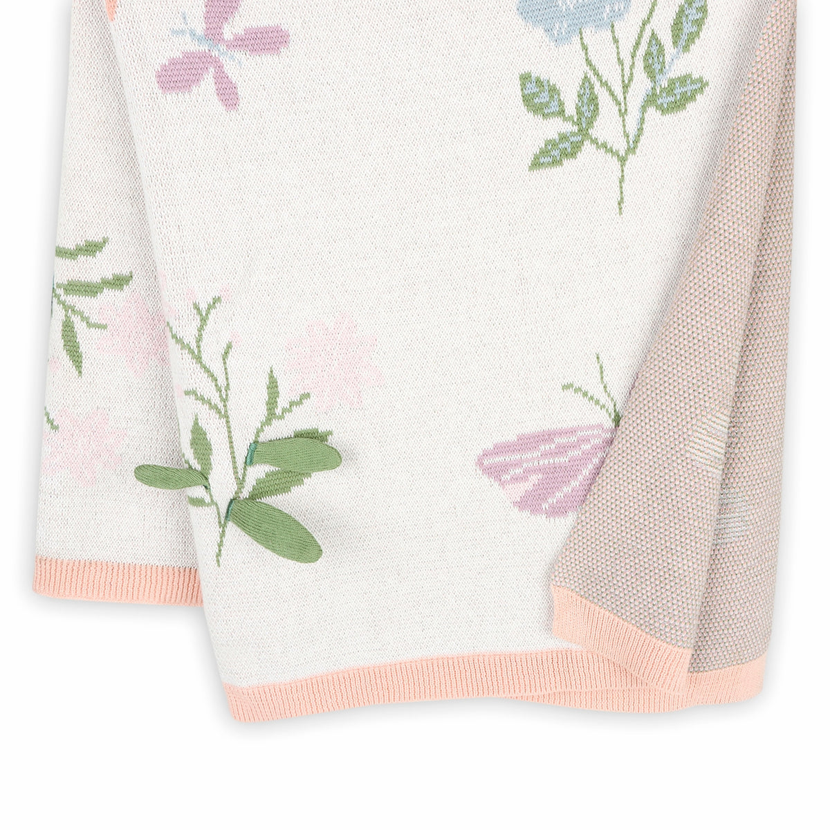Floral patterned fabric with pink and green accents on a white background