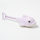 White sand shovel with dolphin design on a white background