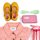 Yellow shoes, pink jacket, green and white fork, pink case with spoon, pink water bottle on a white background