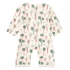 A baby long-sleeve footless romper in cream cotton fabric with an all-over tree print in muted green and gray.