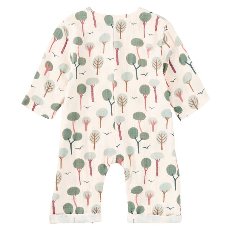 A baby long-sleeve footless romper in cream cotton fabric with an all-over tree print in muted green and gray.