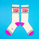 White socks with 'Cool Aunt' text on a blue background