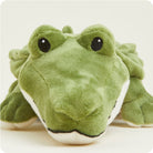 Green plush toy resembling a crocodile on a white background