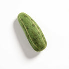 Green felted soap on a white background