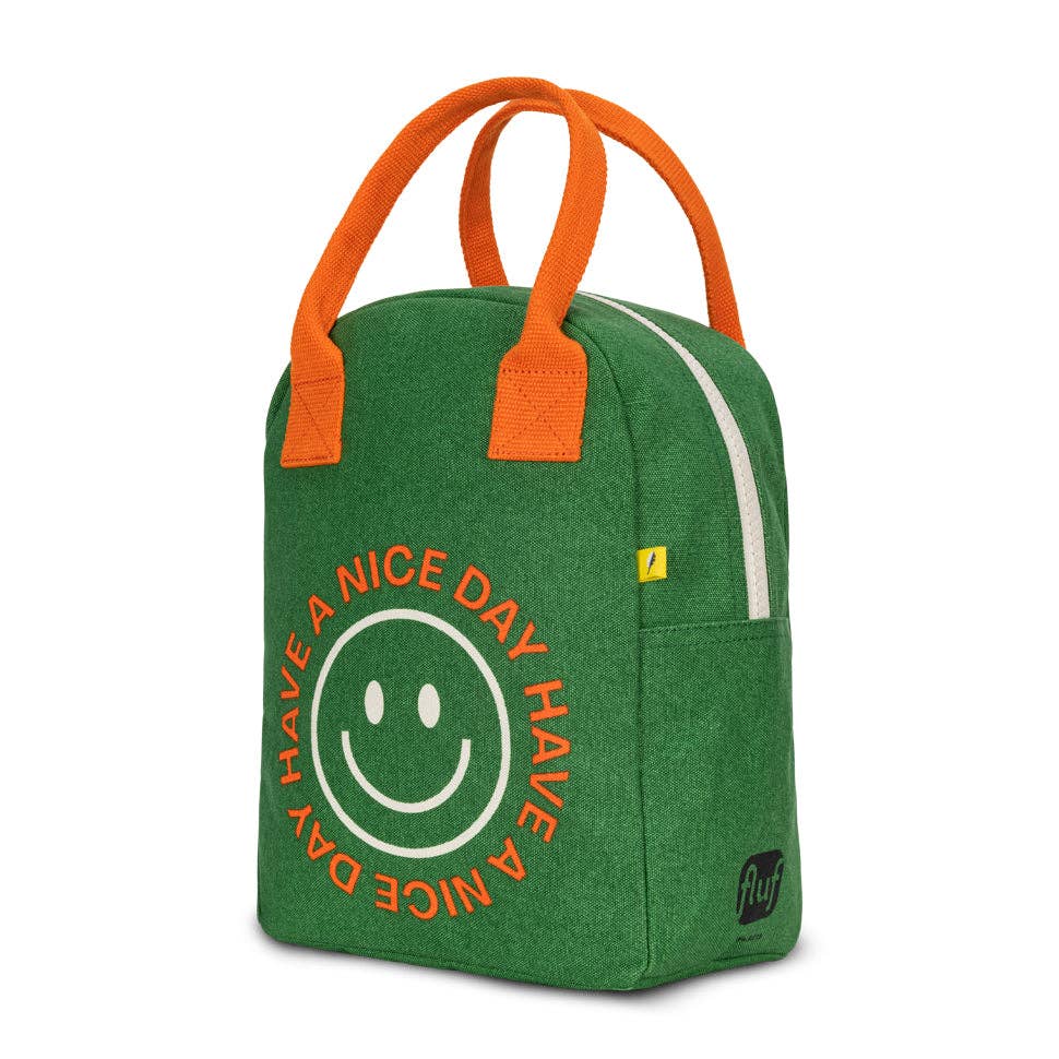 Green bag with orange handles and a smiley face design on a white background