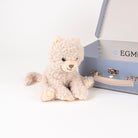 Plush toy cat next to a blue box with 'EGM' branding on a white background