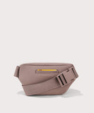 Grey waist bag with a yellow zipper on a light gray background
