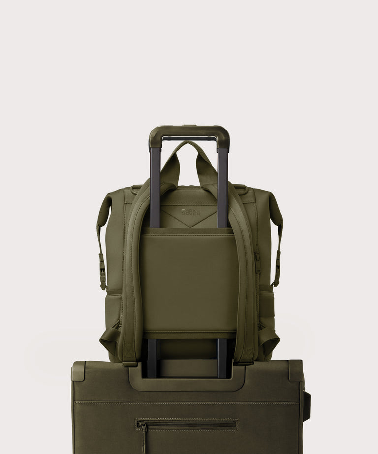 Green rolling backpack on a light gray background