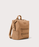 Tan backpack on a light gray background