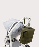 Navy blue backpack attached to a stroller on a light gray background