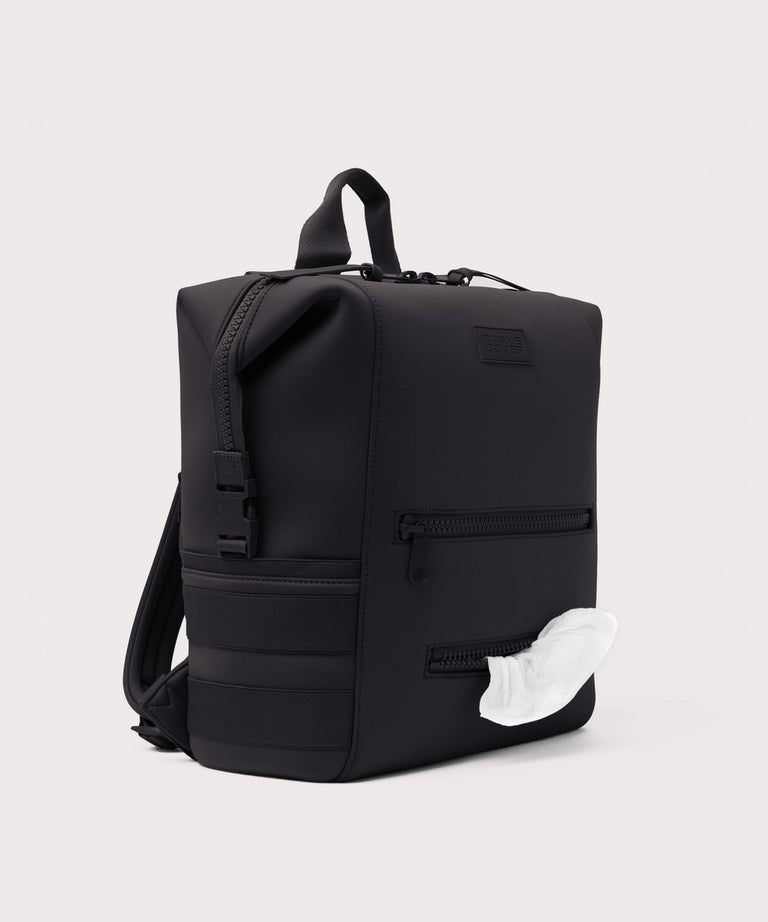 Black backpack with a whale design on a light gray background