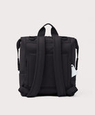 Black backpack on a light gray background