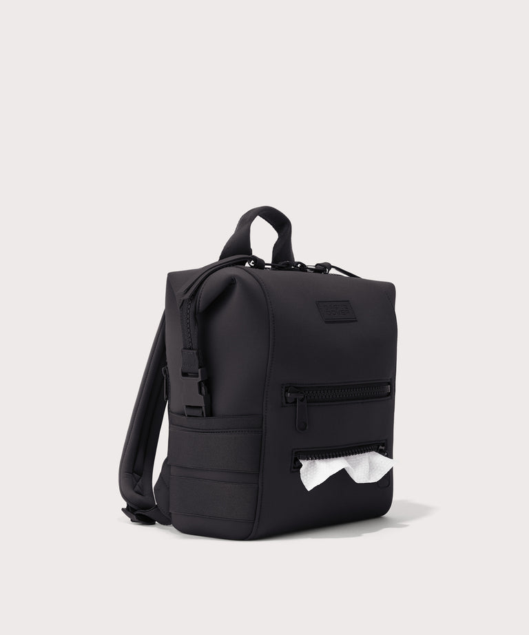 Green backpack on a light gray background