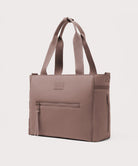 Brown tote bag with a visible brand label on a light gray background