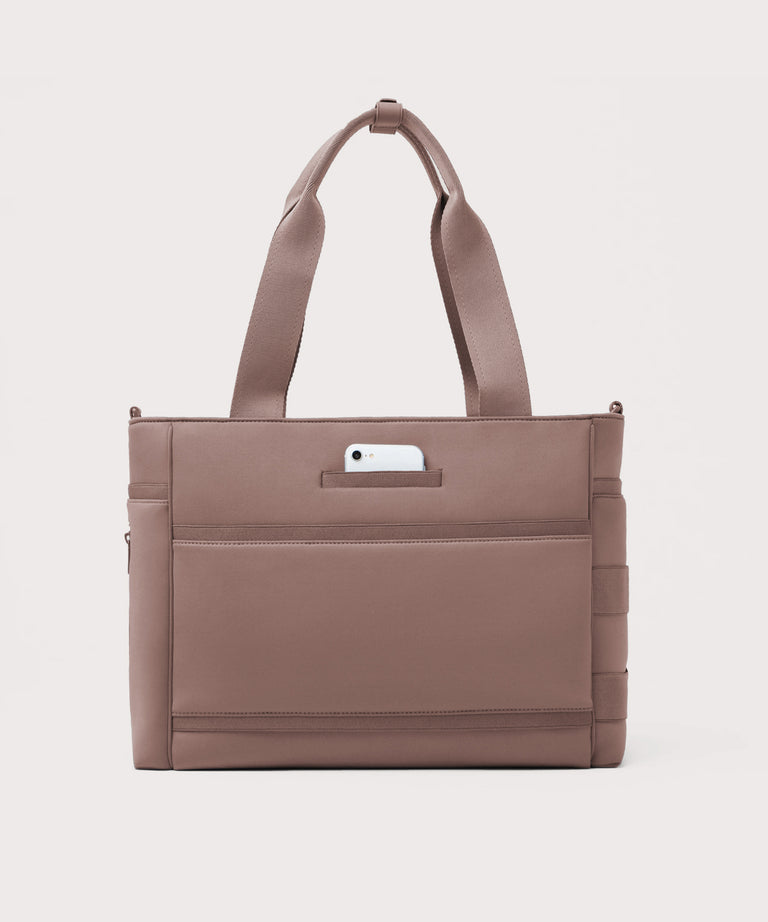 Brown tote bag with a phone pocket on a light gray background