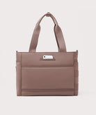 Brown tote bag with a phone pocket on a light gray background