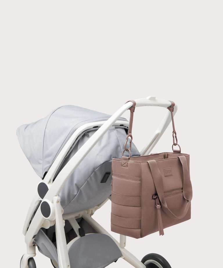 Stroller with a matching handbag on a light gray background