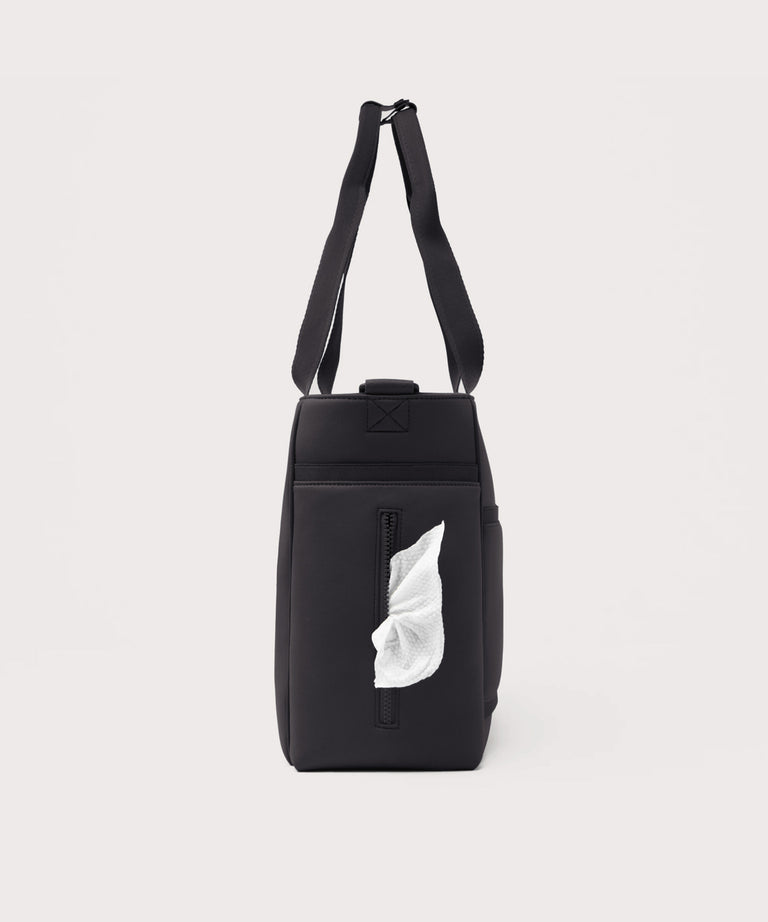 Black bag with a white label on a light gray background