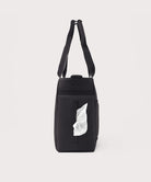 Black bag with a white label on a light gray background