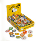 Box of Peanuts button collection with various buttons displayed on a white background