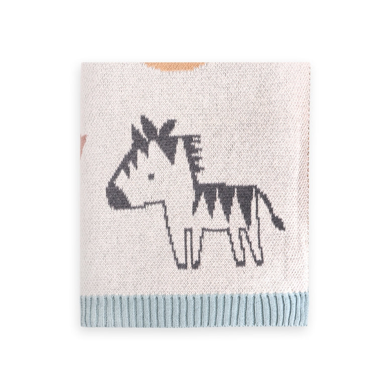 Knitted blanket with zebra design on a white background