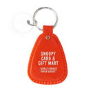 Orange keychain with 'Snoopy Card & Gift Mart' text on a white background
