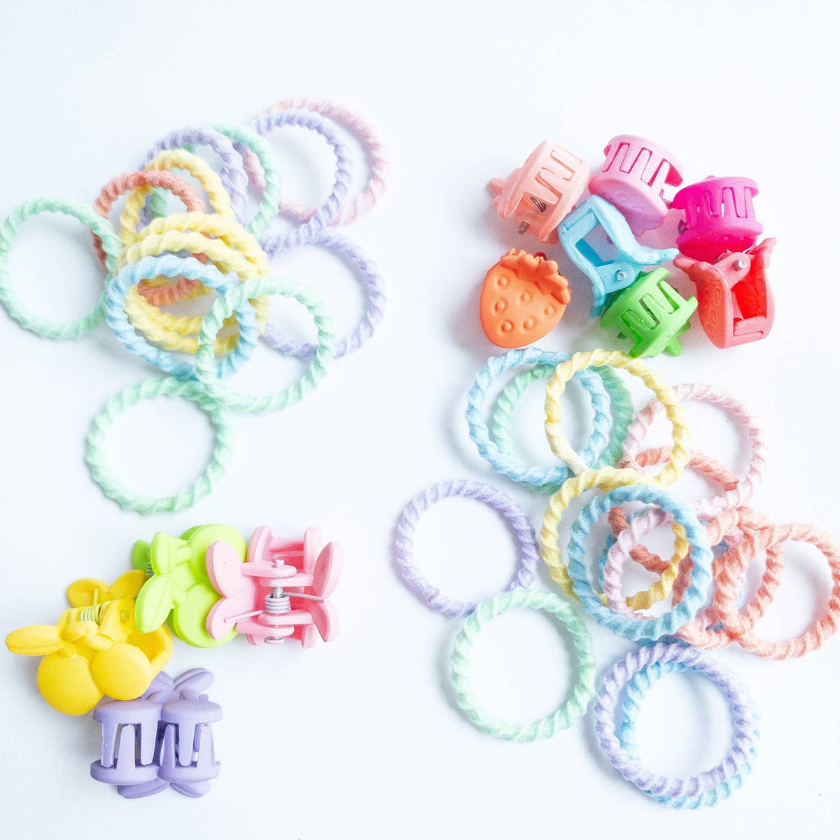 Colorful hair ties and clips on a white background